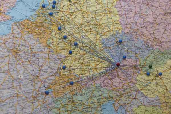 Nodes and networks are shown on a map of Europe with threads and pins, Austria, Europe