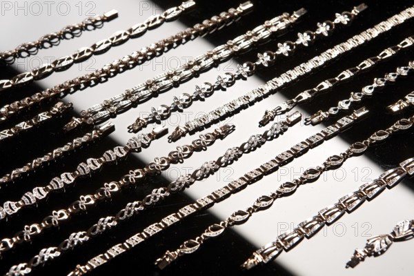 Golden bracelets on a studio background