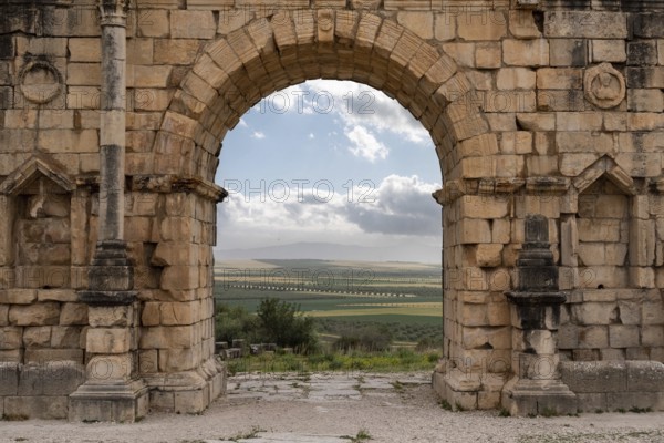 Iconic Triumphal Arch of Volubilis, an old ancient Roman city in Morocco, North Africa