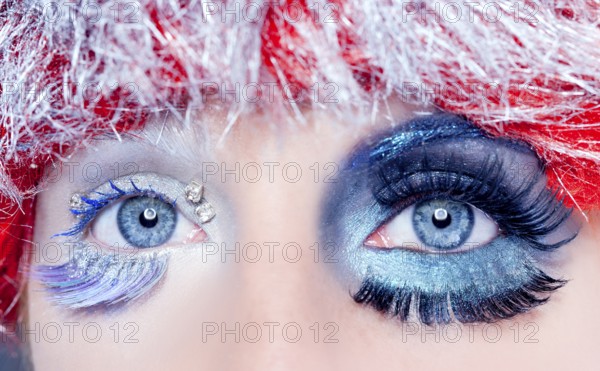 Asymmetrical christmas concept eye makeup winter red silver macro closeup