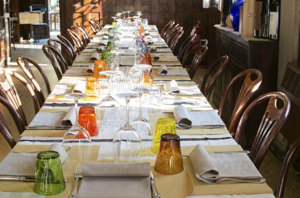 Table in an Italian restaurant. Wooden antique furniture