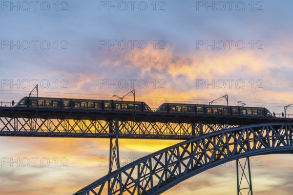 Porto City and Dom Luis Bridge I with Tram at Sunset. Colorful Sky. Portugal