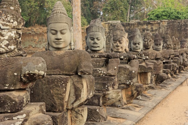 Balustrade with stone gods and demons on the bridge to the southern Tor tor of Angkor Thom