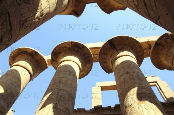 Columns in karnak temple with ancient egypt hieroglyphics