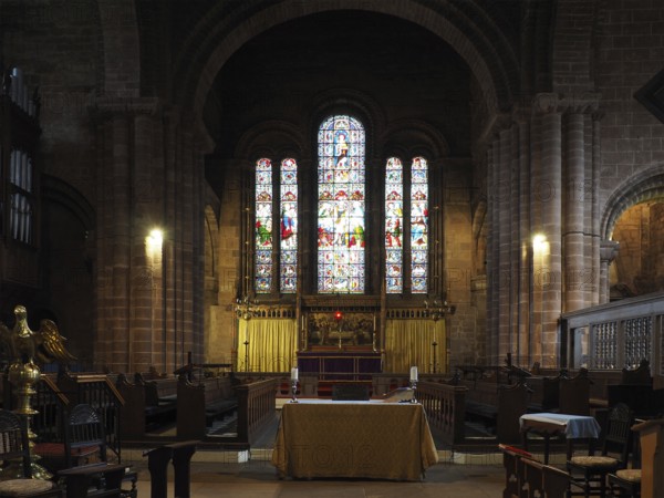 Chester. Cheshire, United Kingdom, 20 March 2024 : The alter and stained glass windows in St John the Baptist's Church, Chester, Europe