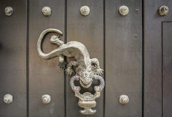Close-up of traditional door knocker on wooden door in Cartagena, Colombia, South America