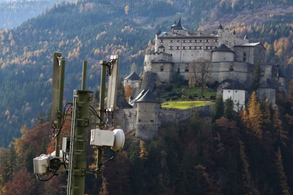 A mobile phone transmitter and Werfenweng Castle, Salzburger Land, Austria Austria