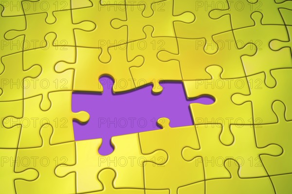 An image of a yellow jigsaw puzzle