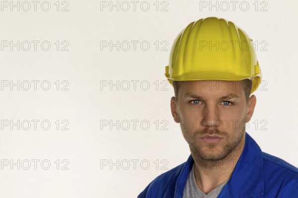 A worker in a commercial enterprise (craftsman) with tools in his hand Austria