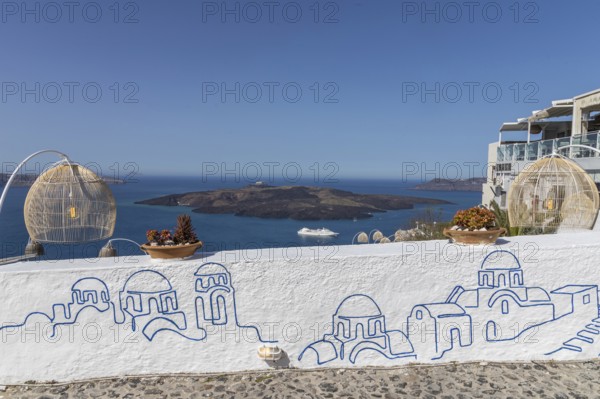 Graffiti on white wall, view from Fira to volcanic island Nea Kameni, island Santorini, Cyclades, Greece, Europe