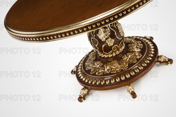 Luxury gold plated part kitchen table in baroque style. Close-up