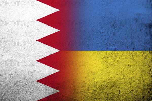 The Kingdom of Bahrain national flag with National flag of Ukraine. Grunge background