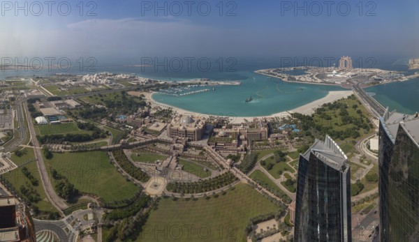 A picture of the Al Ras Al Akhdar District, with the Abu Dhabi Breakwater on the top right corner, the Emirates Palace Mandarin Oriental Hotel in the center, and Qasr Al Watan presidential palace on the top left
