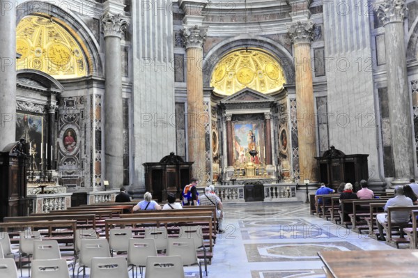St Peter's Basilica, Vatican, Rome, Lazio, Italy, Europe, Church interior with impressive architecture, columns and paintings that create a calm, solemn atmosphere, Europe