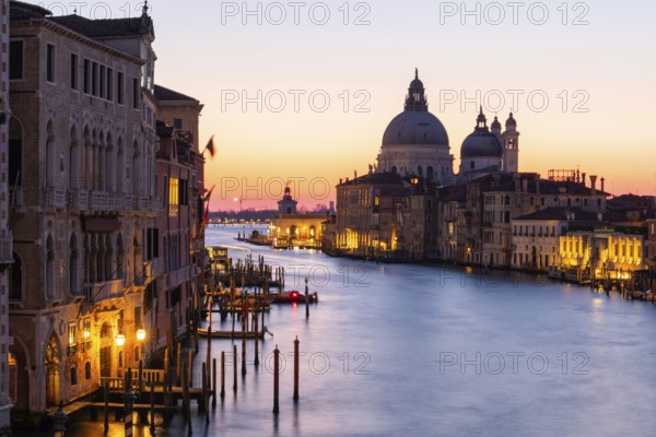 Morning atmosphere in front of sunrise, view of the Grand Canal from the Ponte dell' Accademia, Basilica Maria della Salute in the background, long exposure, Venice, Italy, Europe