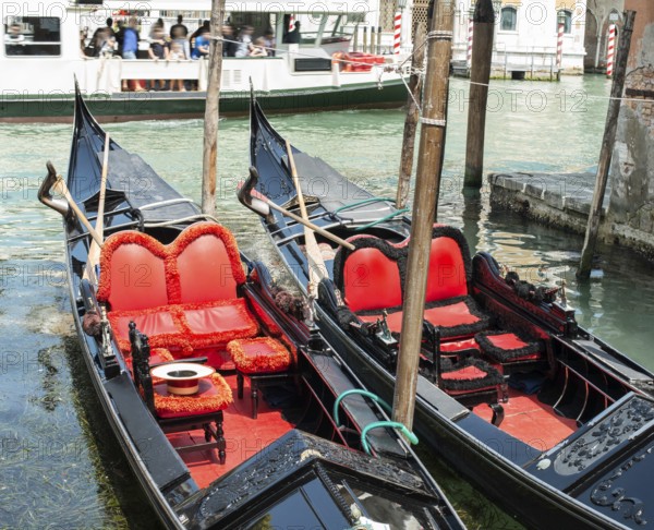 Ancient gondolas boat in Venice. Gondola red color interior