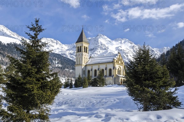 Romantic historic chapel in beautiful mountain landscape in winter
