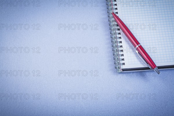 Red ball-point pen notepad office concept