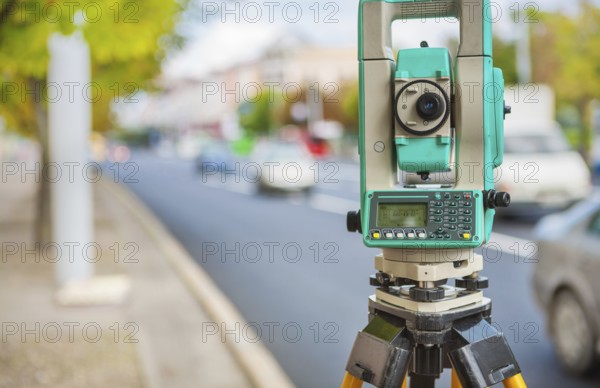 Theodolite on streen of small town