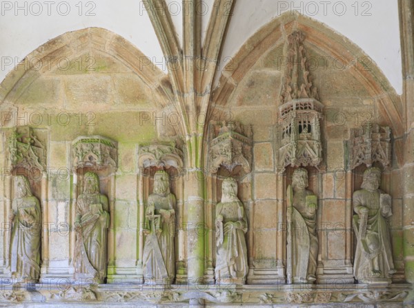 Statues of the apostles in the covered side entrance, enclosed parish Enclos paroissial, Eglise Notre-Dame de Lampaul-Guimiliau, Departement Finistere Penn-ar-Bed, Region Bretagne Breizh, France, Europe