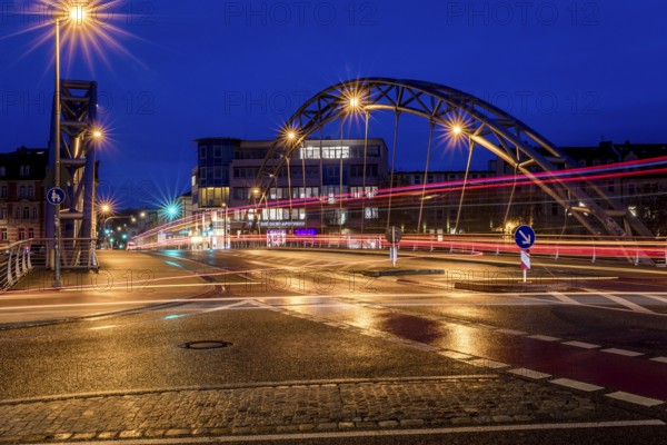 Luitpoldbrücke, Bamberg, Willy-Lessing-Straße, blue hour, city bridge at night with light traces of cars and modern buildings in the background the bridge pharmacy