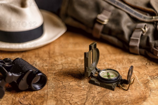 Old expedition map with compass and binoculars