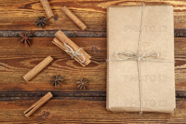 Gift Packed in eco-friendly biodegradable cardboard on dark old wooden background with blank space for text. top view. flat lay