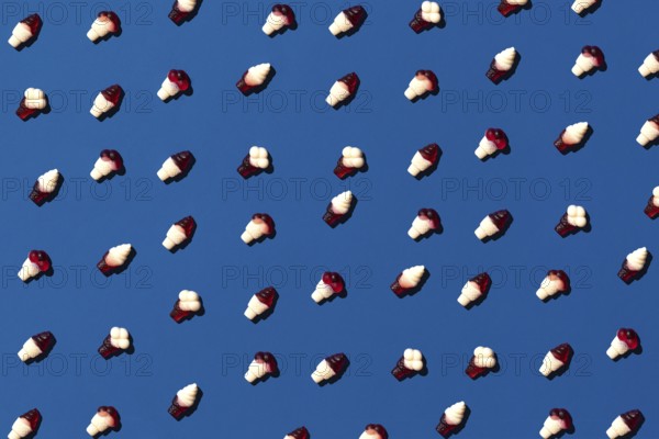 Flat lay photo tasty concept, minimal Sweet Candy jelly bean Colorful pattern on blue pastel background