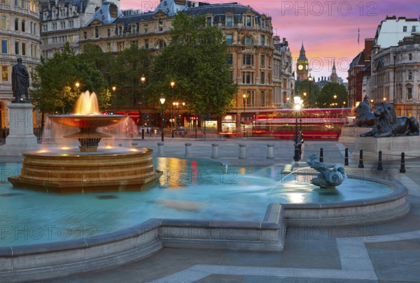London Trafalgar Square fountain at sunset England