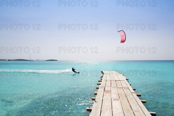 Formentera beach wood pier over turquoise water from balearic Mediterranean sea paradise