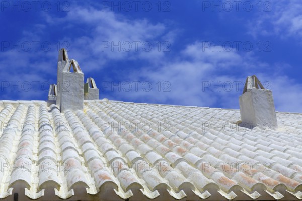 Binibequer Vell in Menorca White roof chimney Sant Lluis at Balearic Islands