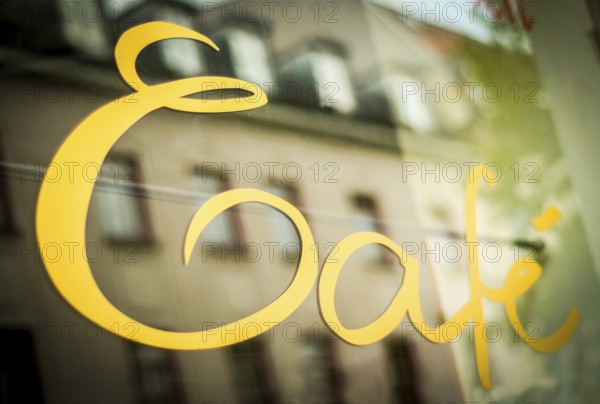 Sign In The Window Of A Urban Cafe