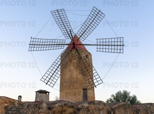 Algaida, Spain, 21 January, 2024: historic windmill in the country town of Algaida in the interior of Mallorca at sunrise, Europe