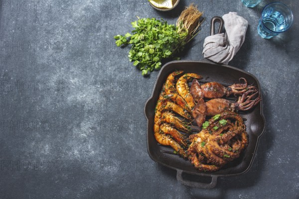 Food, Grilled spimps, squids and octopus in cast iron grill pan