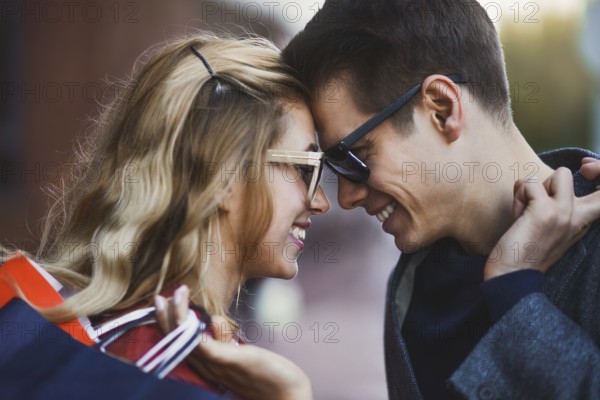 Picture showing young couple shopping in the city. Portrait of a couple with shopping bags in the city.People, sale, love and happiness concept