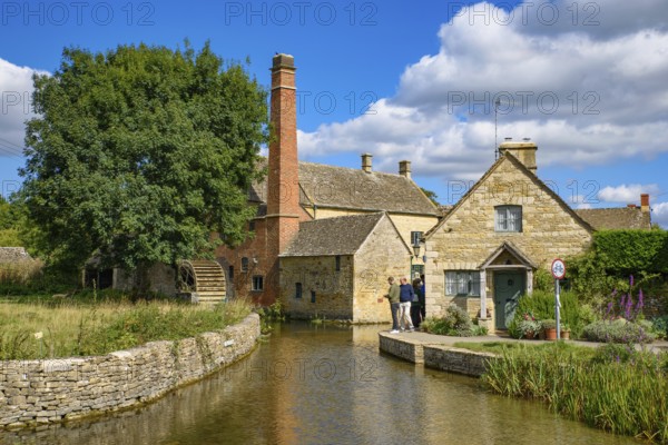 Old water mill in Lower Slaughter, a village in Cotswolds area, England, UK