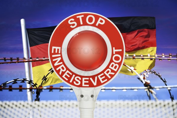 Police trowel with the inscription Stop Entry Ban in front of the German flag and barbed wire, symbolic photo for border controls and rejection at the German national borders, photomontage