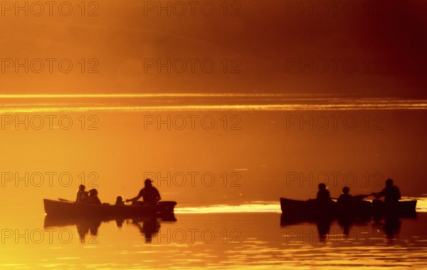 Sunset Sillouette Canoe orange color Saskatchewan Canada