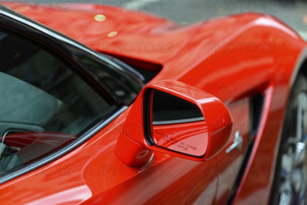 Red Corvette, Manhattan, New York City, New York, USA, North America, Red car with close focus on side rear view mirror on shiny surface, North America