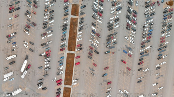 Car park full of vehicles. Panoramic bird's eye view