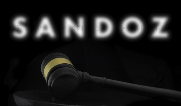 Court gavel in front of the Sandoz logo. Sandoz Group AG is a Swiss company generic pharmaceuticals and biosimilars