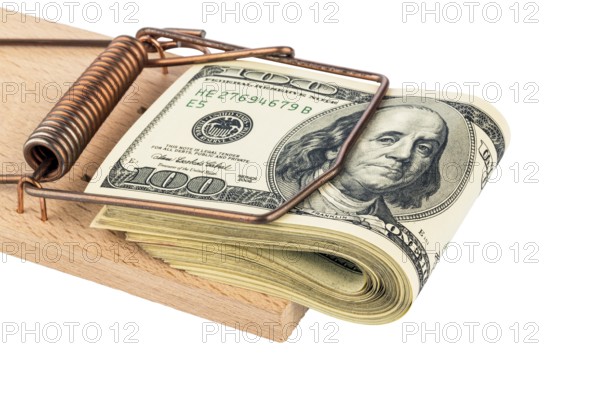 Dollar banknotes in a mousetrap. Symbol photo for debt