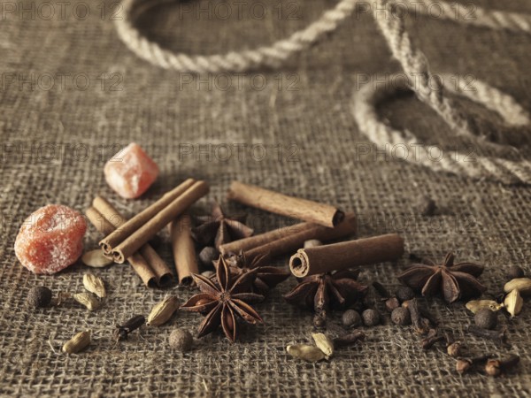 Spice mix for hot wine over the burlap background