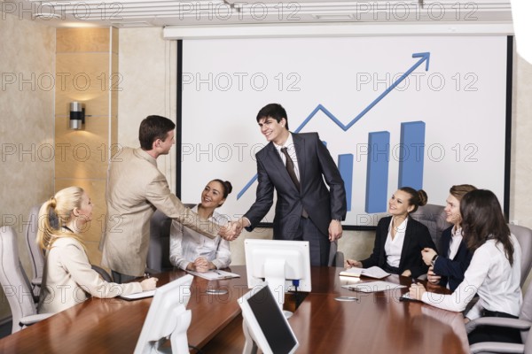 Business people shaking hands, finishing up a meeting