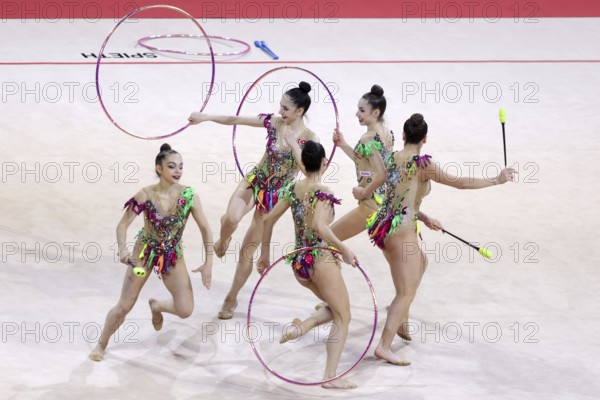 Sofia, Bulgaria - 27 March, 2021: Team Turkey perform during the 3 Hoops + 2 pairs of Clubs group qualifications at the 2021 Rhythmic Gymnastics Sofia World Cup, Sofia, Bulgaria, Europe
