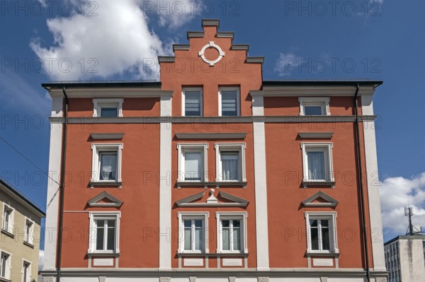 Red classicist façade with stepped gable, Kempten, Allgäu, Swabia, Bavaria, Germany, Europe