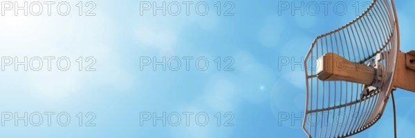 A special openwork antenna used in the telecommunications industry as well as cellular networks and wireless Internet. Technology of digital sending and receiving of data packets. The sun in the lens. Panoramic view