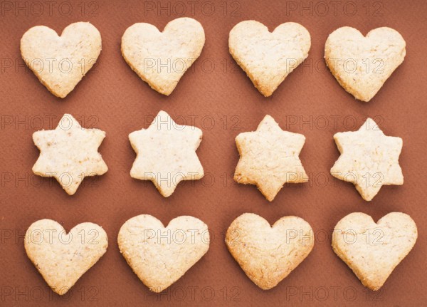 Holiday cookies as a background pattern on brown