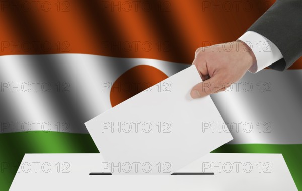 The Niger flag and the hand with the bulletin about the ballot box