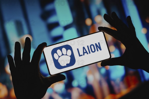 In this photo illustration, the LAION AI (Large-scale Artificial Intelligence Open Network) logo is displayed on a smartphone screen